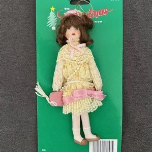 The Christmas collection Victorian Porcelain Doll Ornament With Crossbody Bag.